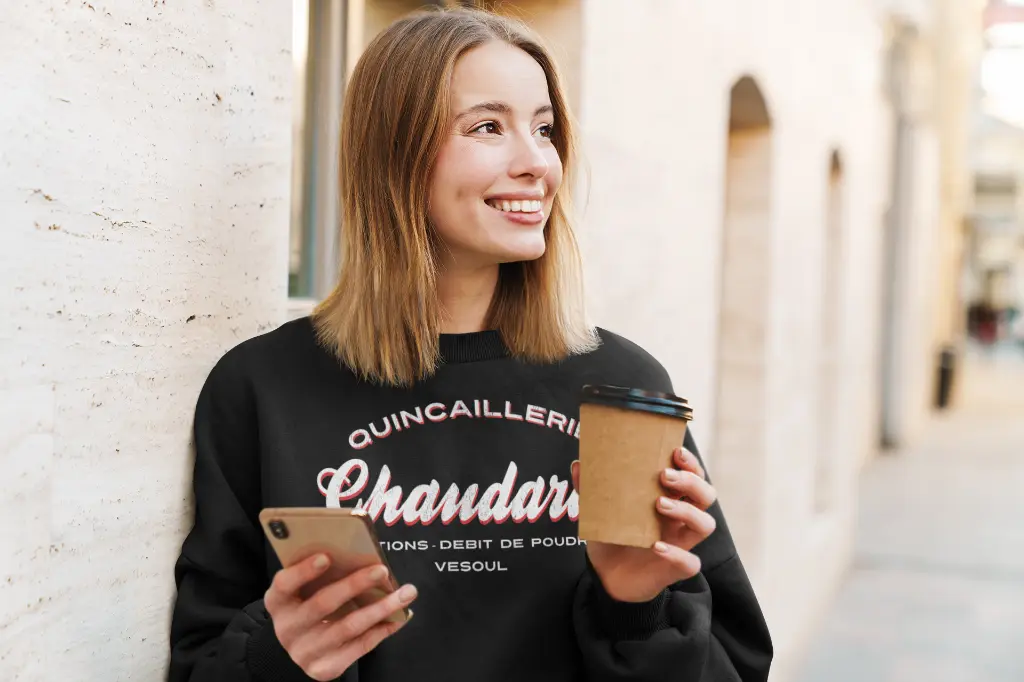 mockup-of-a-woman-wearing-a-crewneck-sweatshirt-on-the-street-39821-r-el2.webp